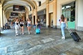 Tourists trasporting trolleys downtown in san carlo square arcades Turin Italy