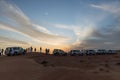 Tourists with travel cars parking for see the sun down in the evening in the great desert at Dubai Royalty Free Stock Photo