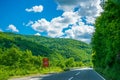 Tourists travel on the mountain roads of Montenegro by car.