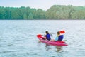 Tourists travel by raft boats to relax and kayaking to watch the red hawks and mangrove forest in the sea at Bang Chan The No-