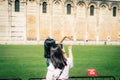 Tourists traveler asian chinese, japanese female women girls are posing, having fun, make stereotypical photos, show size, hold wi