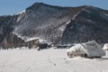 Tourists traveling across snow field