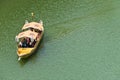 The tourists are traveling on the golden vintage Japanese boat