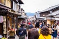 Tourists are traveling in Kyoto traditional shopping street.