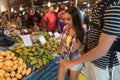 Tourists On Tropical Exotic Market Young People Buying Fresh Fruits In Asian Traditional Bazaar Royalty Free Stock Photo