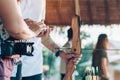 Tourists try to use a bow and arrow and shoot at a target Royalty Free Stock Photo