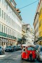 Tourists In Tuk Tuk Vehicles Visiting Major Attractions Downtown Lisboa City Royalty Free Stock Photo