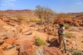 Tourists in Twyfelfontein, site of ancient rock engravings in the Kunene Region of north-western Namibia