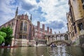 Tourists under Bridge of Sighs at Saint John`s College. Named for a famous Venice landmark, this circa-1831 covered arch bridge co