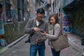 Tourists using map on digital device Royalty Free Stock Photo