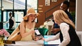 Tourists using nfc payment at reception Royalty Free Stock Photo