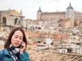 Tourists using telephone at Toledo, Spain