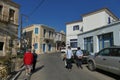 tourists of various nationalities go to the characteristic market of typical products in Potamos, Greece