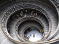 Tourists at the Vatican museum`s round stairs