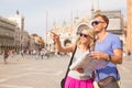 Tourists in Venice looking for directions Royalty Free Stock Photo