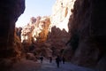 Tourists view the canyon ancient city of Petra in Jordan