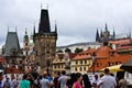 Tourists view Prague from Charles Bridge