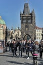 Tourists view Prague from Charles Bridge