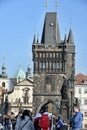 Tourists view Prague from Charles Bridge