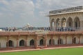 Tourists view the Taj Mahal from Agra Fort