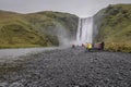 An Unrecognizable Group of People at Skogafoss