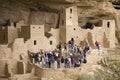 Tourists viewing kiva at Cliff Palace cliff