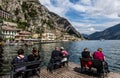 Tourists viewing a landscape of lake Garda