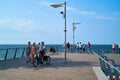 Tourists on a viewing platform on the beach of Rewal