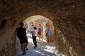 Tourists visit the city inside the mythical castle of Monemvasia Royalty Free Stock Photo