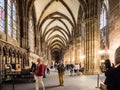 Tourists view the interior of the Strasbourg Cathedral, France