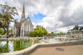 Tourists visit the Gefion Fountain and the English St. Alban`s Church in Copenhagen, Denmark