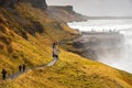 Tourists visit gullfoss waterfall in Iceland