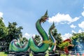 Tourists visit the Naga statue in Jonny Farmstay, Ubon Ratchathani Province, Royalty Free Stock Photo