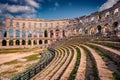 Tourists visit popular destination - Pula Arena, Huge Roman amphitheater Royalty Free Stock Photo