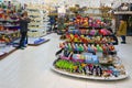 Tourists visit souvenir shop in Prague, Czech Republic. Famous Bohemian glass on shelves in gift store