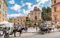 Tourists visiting Bellini square and San Cataldo church in the center of Palermo.