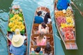 Tourists visiting by boat at Damnoen Saduak floating market Royalty Free Stock Photo