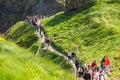 Tourists visiting Carrick-a-Rede Rope Bridge in County Antrim of Northern Ireland