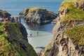 Tourists visiting Carrick-a-Rede Rope Bridge in County Antrim of Northern Ireland