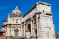 Tourists visiting the Church of Santi Luca e Martina and the Arch of Septimius Severus at the Roman