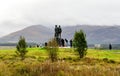 Tourists visiting the Commando Memorial monument in a cloudy weather near Spean Bridge village, Lochaber, Scottish Highlands Royalty Free Stock Photo