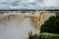 Tourists visiting the Devil s throat waterfall in the Iguazu Falls, one of the seven natural wonders of the world. Missions, Royalty Free Stock Photo