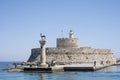 Tourists visiting the Doe statues in Rhodes harbor at Mandraki in Rhodes Greece