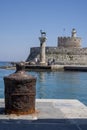 Tourists visiting the Doe statues in Rhodes harbor at Mandraki in Rhodes Greece