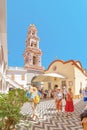 Tourists visiting famous monastery Panormitis on the island of Symi, Greece. Dodecanese