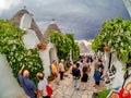 Tourists visiting the famous village Of Trulli, in Alberobello