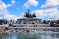 Tourists visiting Gefion Fountain, a group of animal figures being driven by the Norse goddess Gefjon, Copenhagen, Denmark