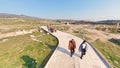 Tourists visiting the historical Ruins of the ancient city of Hierapolis, Pamukkale, Turkey