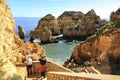 Tourists visiting the Natural features, cliffs and limestone formations of Ponta da Piedade