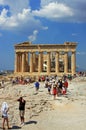 Tourists visiting the Parthenon building on top of the Acropolis, in Athens, Greece